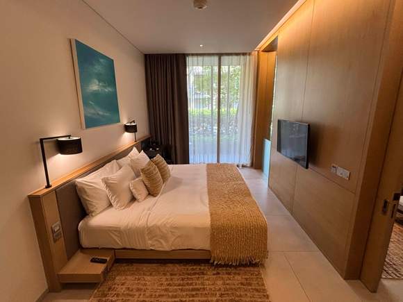 Bedroom with second patio through the sliding glass doors.  