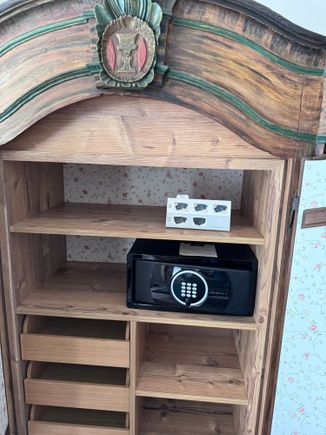 Again the modern safe is hiding in an antique cupboard