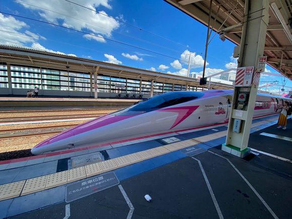 Waiving goodbye to the Hello Kitty Train