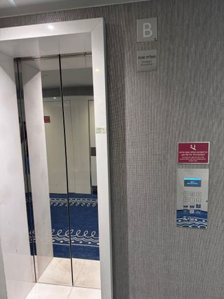 One of the lifts is a Shabbat lift this will stop at each floor during Shabbat’s. The other two elevators run as normal.  You type ninth floor and are told which lifts to take. If you are in lower floors, you will not be able to walk between towers. This is only possible at the lobby level or on the higher floors