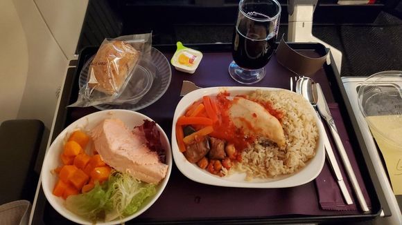 This was the gluten free GFML meal HKG-EWR. Chicken and rice, a salad with cubed carrots and slice of salmon, crummy gluten free bread, and ANOTHER half-filled glass of wine.