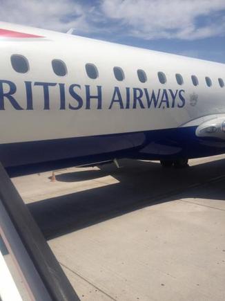 Close up of the BA E190 at Granada airport in June 2014.