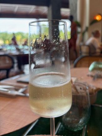 A glass of sparkling wine during breakfast