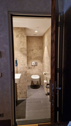 Half bathroom attached to living room.