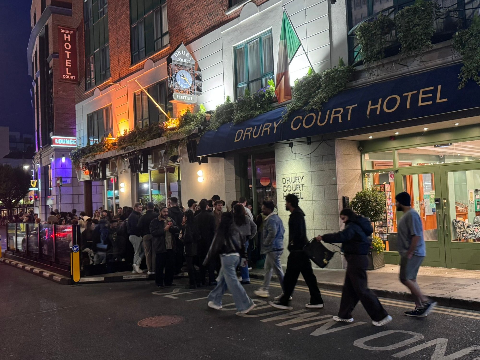 The evening crowd in front of our hotel, Drury Court Hotel.