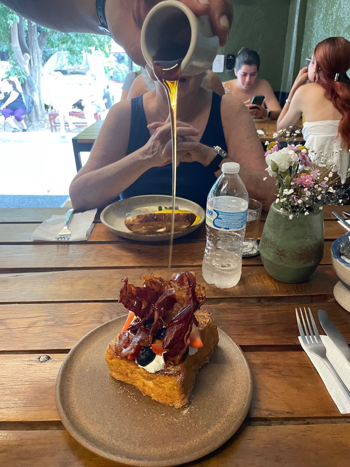 The French Toast is the best.  It is a big slice of bread with fresh berries, yogurt and about 5 big strips of bacon.  The make a show of pouring the syrup over your toast.  A nice touch!