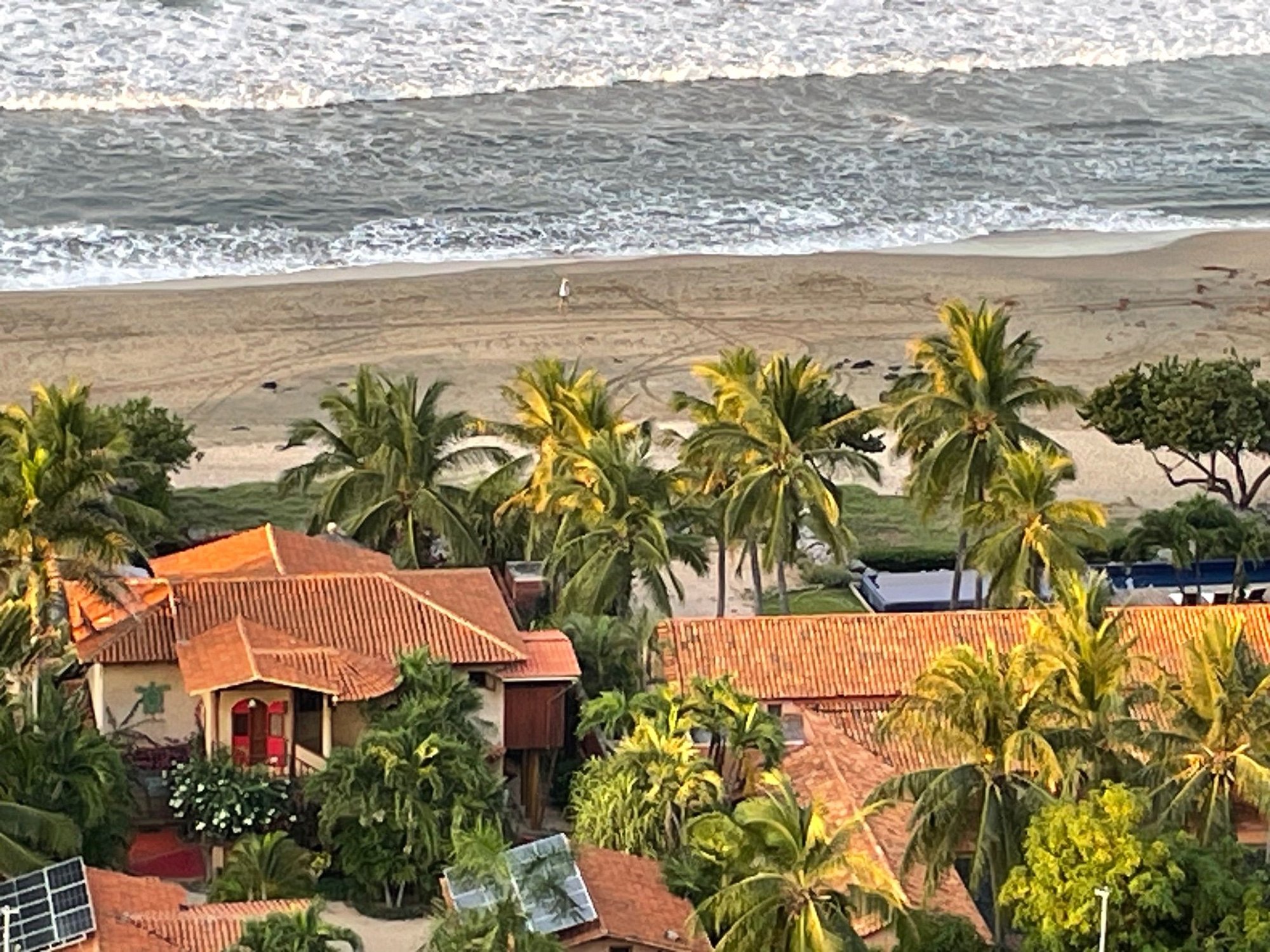 Looking straight down from the platform.  You can see a little figure in white on the beach