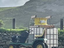 Wales. We visited a sheep farm. John Deere lawn tractor. ( pic takes for my son). 