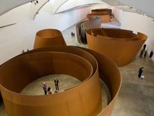 Sculpture inside by Richard Serra. You get incredibly disoriented walking around the circles which have hard to see angles due to the construction.