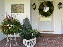 We still need to add some berries to the basket of holly. I think this and my glass tree collection will give us spirit. We also put candles in our windows. I’ll update with an evening photo. 