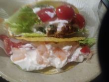 Shrimp taco and turkey taco  with whole milk yogurt and grape tomatoes and shredded lettuce. 