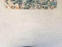 This is a broken plate mosaic I made a few years ago and which now hangs by our front door in Tucson.