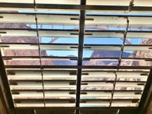 At the end of this inspection tunnel within the 130 foot dam wall, there are these slats providing ventilation, and views!