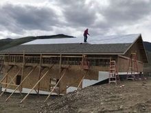 My mom sent this pic of her shingling the shop last weekend.