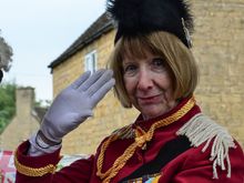 One float included depictions of the Queen throughout different stages of her life. Not pictured here was the local gal/Queen-lookalike dressed in her thick, traditional pink, plain matching clothes.