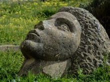 I highly recommend a stroll right up to the isle's highest point, the Terra Murata neighborhood. That summit is a quiet residential enclave, a genuine village. Go past the old cannons plus the large stone sculpture shown here.