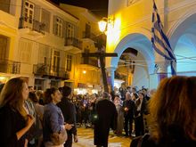 The cross is carried out and leading the procession 