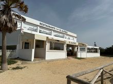 EL ALFEREZ, Beach of El Palmar, about 12 minutes by car from Vejer.  The restaurant faces the beach road, with the dunes and wide, windswept beach beyond. Many surfers were out the day I ate here in mid-March.