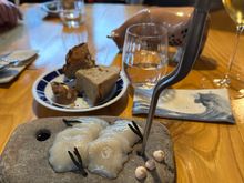 Raw veiras, a species of scallop, with the plate of excellent breads in rear.  