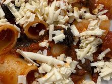 One half of an order of mezzo paccheri all Norma.