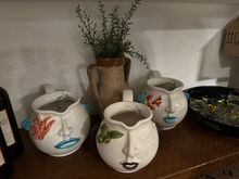 Those enchanting ceramic pitchers...I have vowed not to buy any more table accessories due to disastrous overcrowding in my house.  But they certainly would make a unique gift!   Sold on Salina only at this restaurant.