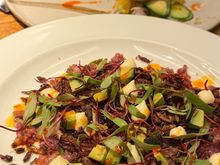 Beef carpaccio with grasshoppers, and a almost-finished fish tostada.