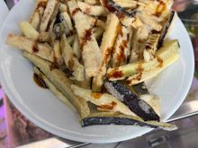 fried eggplant sticks drizzled with molasses