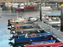 Fishing boats in the harbor, where there is also a sandy beach where kids were swimming in the very chilly sea.