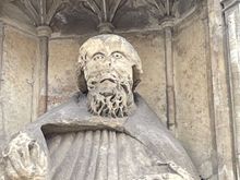 This is easier to explain than to see from this picture. This is a statue of Peter.  After Henry the VIII got rid of the Church, someone vandalized Peter's head.  So this head, has actually been carved out of what was left of his beard.  That's why the wierd face.