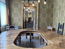 I think we scanned a QR code for the audio tour of the house. I don't remember why this table has a hole in the middle. 