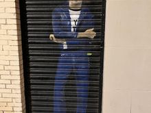 John Lennon mural painted on garage door. 