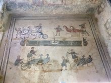 Children racing chariots with birds