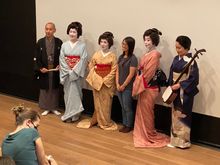 People posed with the geisha and musicians after the show