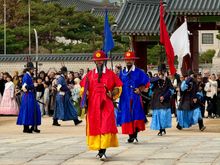 Actors reenact the changing of the guard twice daily 