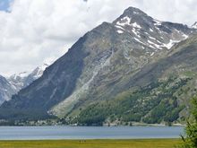 2 people walking in meadow  - for scale 