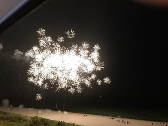 Fireworks on the beach outside our window. If you zoom in on the firework it’s interesting.