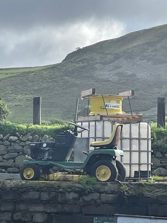 Wales. We visited a sheep farm. John Deere lawn tractor. ( pic takes for my son). 