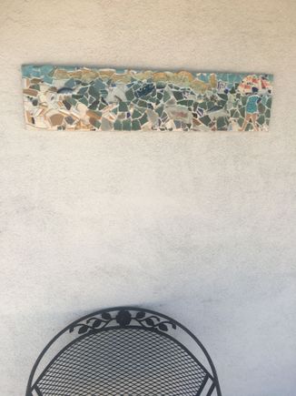 This is a broken plate mosaic I made a few years ago and which now hangs by our front door in Tucson.