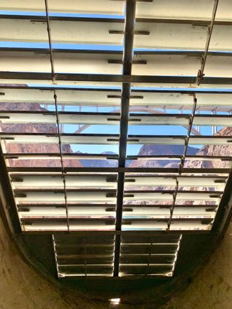 At the end of this inspection tunnel within the 130 foot dam wall, there are these slats providing ventilation, and views!