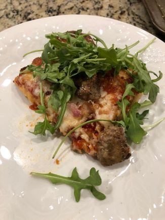 My slice of meatball pizza piled with arugula.  This was the best pizza I’ve ever made.  I shredded whole milk mozzarella and used a new type of parm.  I made the sauce my regular way with canned, fresh and sun dried tomatoes and fresh herbs, olive oil and a few other things thrown in. 