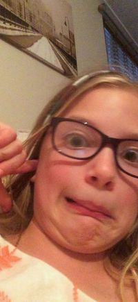 Grandpa showing her something "gross". Mealworm peanut butter bird food. My sweet lil Annie Joy.