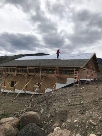 My mom sent this pic of her shingling the shop last weekend.