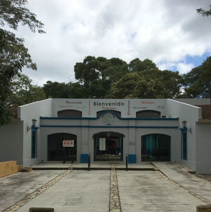 The Visitors' Center.  The Chorti Mayan phrase for "welcome" appears towards the upper right, below the orange "Welkom."
