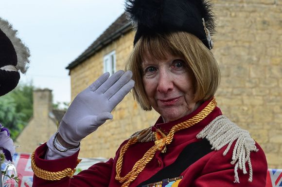 One float included depictions of the Queen throughout different stages of her life. Not pictured here was the local gal/Queen-lookalike dressed in her thick, traditional pink, plain matching clothes.