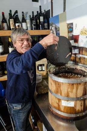 It also has an unusually high number of excellent restaurants for such a small place. Seen here is Gennaro, owner of the justly popular 'Aqua Pazza' restaurant. He had taken us next door to show his 'Colatura di alici' workshop. That was where he created his signature stinky fish sauce. 