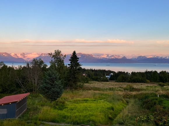 Sunset view from our Airbnb; you can see the Grewingk glacier (where we hiked to yesterday) to the left of the trees