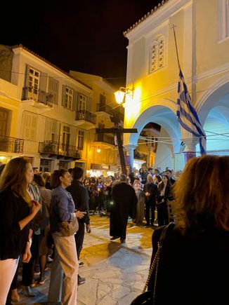 The cross is carried out and leading the procession 