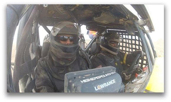 For offroad racing, fire suits also required as well as good roll cage. DS is co-driver on left reading gps because driver can't always see the trail.