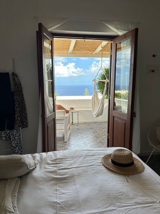 Our room, a superior double with terrace overlooking the sea.  Like all the rooms, it is on the small side with bed taking up most of the space.  But perfect for us!   A shady terrace overlooks the sea, and the islands of Stromboli and Panarea.  Terrace has one VERY comfy chair but that always seems to be occupied when I want to read there.  Also a hammock which I will try later.  Maybe.