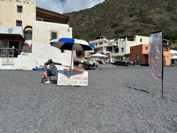 Entering the (entirely public) Rinella Beach, we encountered the option to rent comfy lounges (with shades that cover your head) and an umbrella--one for two loungers.  (20 euro for all,  in September)